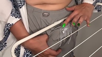 Stepbrother Watches As His Stepmother Pleasures Herself With Her Large Breasts In The Laundry Room